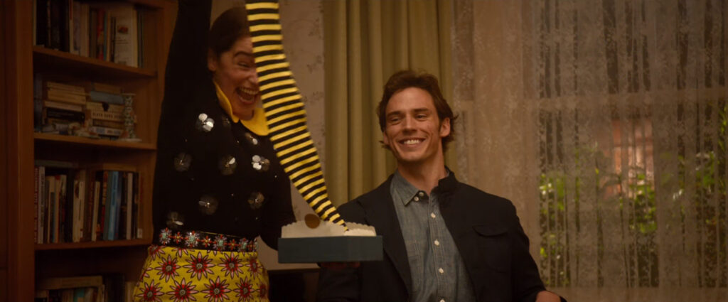 A still from the movie "Me Before You" where the girl unpacks the gift of Bumble Bee Stockings